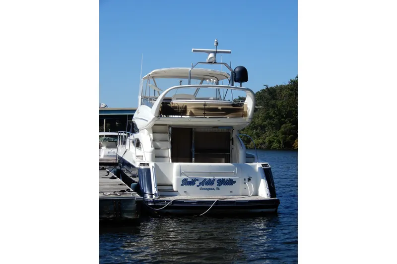 Slide: The Image of 2008 Viking Sport Cruisers 61 Motor Yacht docked on a sunny day. - 5