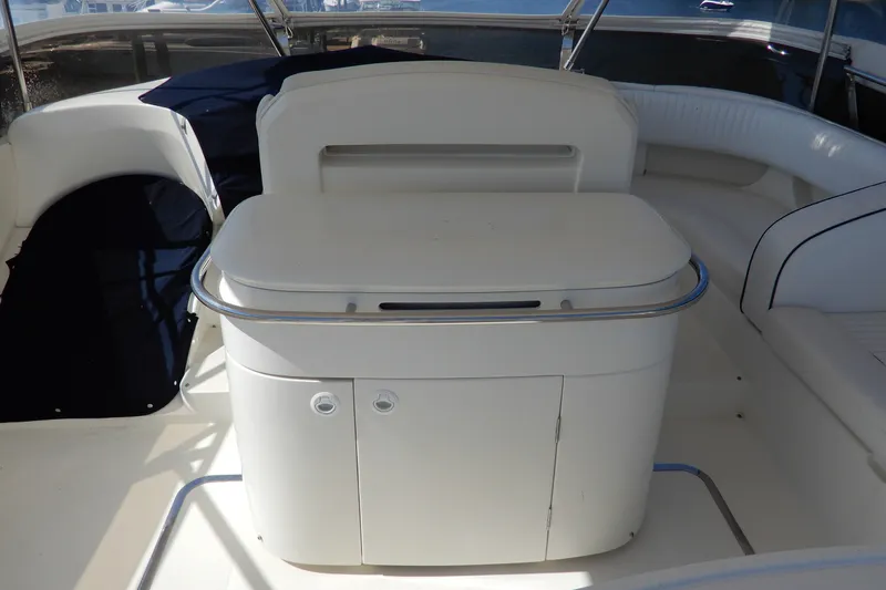 Slide: The Image of 2008 Viking Sport Cruisers 61 Motor Yacht interior with sleek white cabinetry and seating. - 35