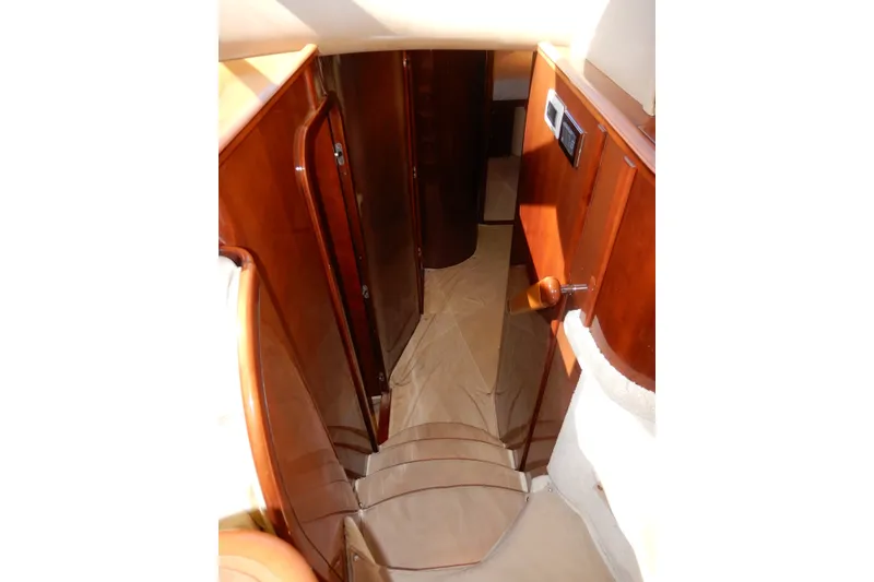 Slide: The Image of Interior view of 2008 Viking Sport Cruisers 61 Motor Yacht, featuring polished wood finishes. - 89