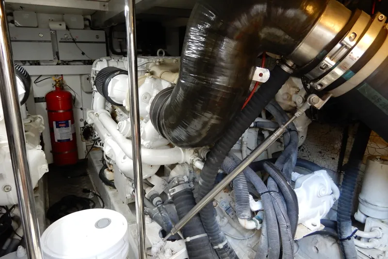 Slide: The Image of Engine room of 2008 Viking Sport Cruisers 61 Motor Yacht with visible machinery and fire extinguisher. - 124