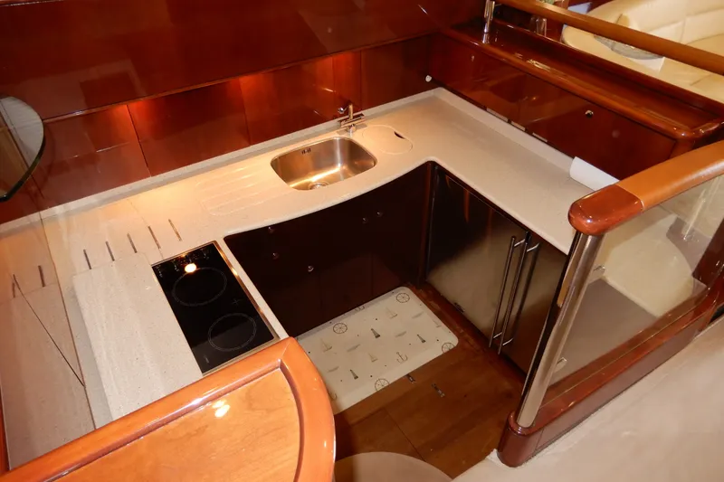 Slide: The Image of Luxurious kitchen area in a 2008 Viking Sport Cruisers 61 Motor Yacht. - 71