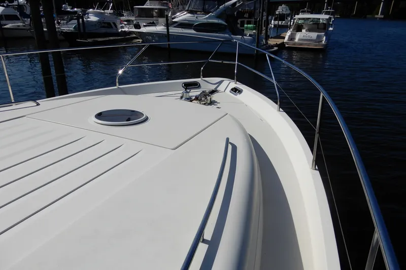 Slide: The Image of 2008 Viking Sport Cruisers 61 Motor Yacht bow view at marina. - 18