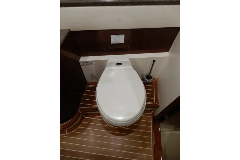 Slide: The Image of Luxury yacht bathroom with modern toilet, wooden flooring, Viking Sport Cruisers 61 Motor Yacht 2008. - 122