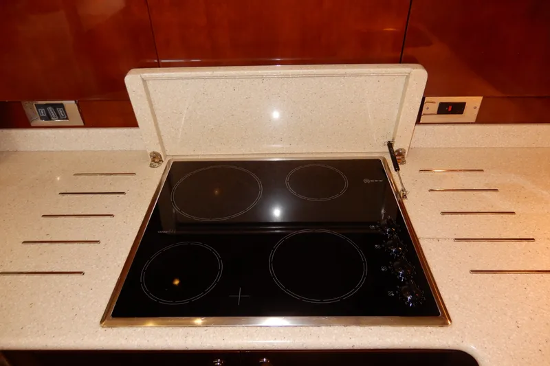 Slide: The Image of Modern stovetop in 2008 Viking Sport Cruisers 61 Motor Yacht kitchen. - 74