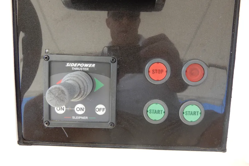 Slide: The Image of Control panel of 2008 Viking Sport Cruisers 61 Motor Yacht with thruster joystick. - 48