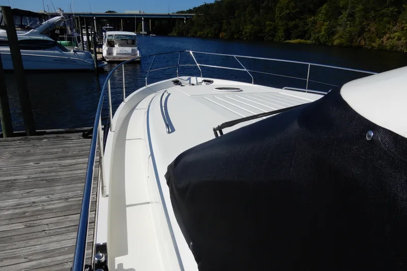 Slide: The Image of 2008 Viking Sport Cruisers 61 Motor Yacht docked at marina, sunny day. - 24