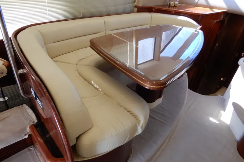 Slide: The Image of Luxurious interior of 2008 Viking Sport Cruisers 61 Motor Yacht with elegant seating and table. - 65