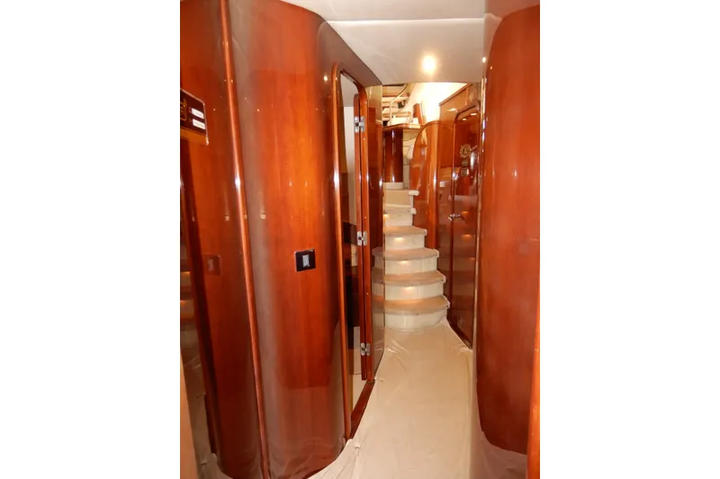 Slide: The Image of Luxurious interior hallway of 2008 Viking Sport Cruisers 61 Motor Yacht with polished wood finish. - 123