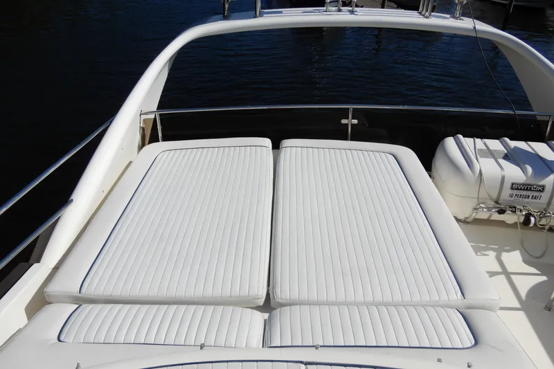 Slide: The Image of 2008 Viking Sport Cruisers 61 Motor Yacht sun deck with white cushioned seating. - 32