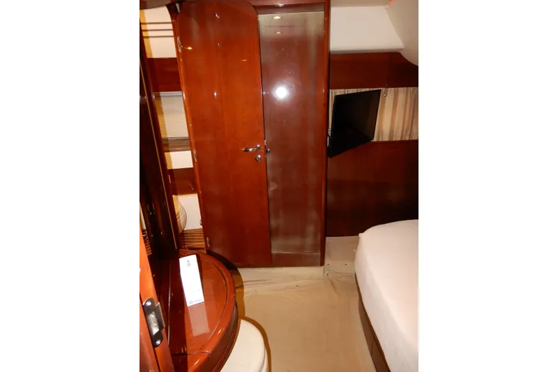 Slide: The Image of Luxurious interior of 2008 Viking Sport Cruisers 61 Motor Yacht cabin with wood finish. - 113