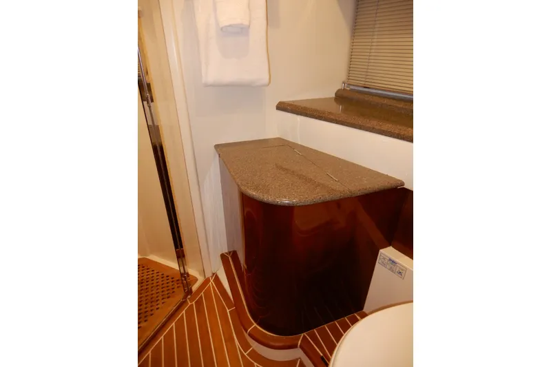 Slide: The Image of Luxurious bathroom interior of 2008 Viking Sport Cruisers 61 Motor Yacht with wooden accents. - 120