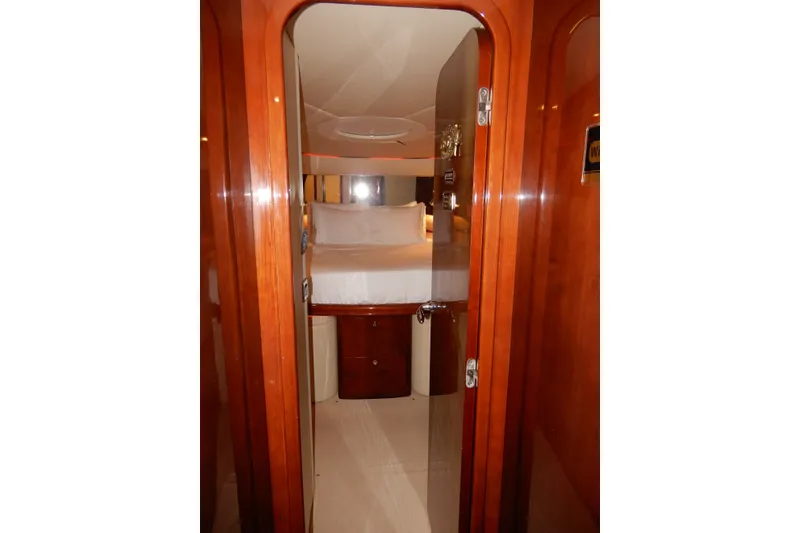 Slide: The Image of Luxurious cabin interior of 2008 Viking Sport Cruisers 61 Motor Yacht with wooden finish. - 100