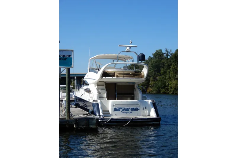 Slide: The Image of 2008 Viking Sport Cruisers 61 Motor Yacht docked on a sunny day. - 6