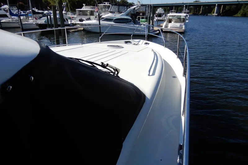 Slide: The Image of 2008 Viking Sport Cruisers 61 Motor Yacht docked at marina, view of bow and railing. - 17