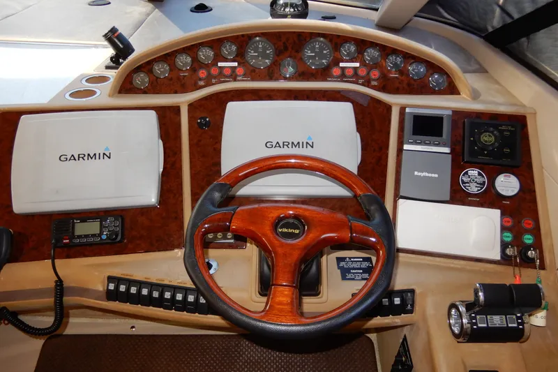 Slide: The Image of Cockpit of 2008 Viking Sport Cruisers 61 Motor Yacht with Garmin navigation systems. - 83
