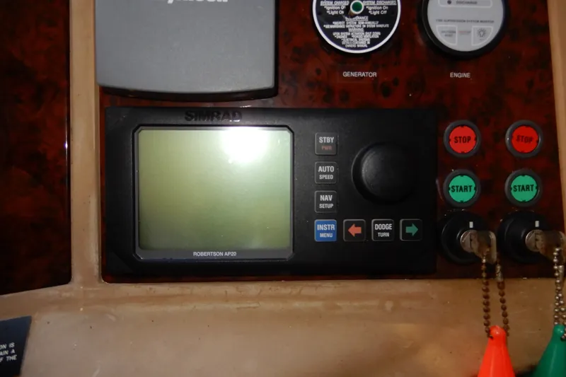 Slide: The Image of Control panel of a 2008 Viking Sport Cruisers 61 Motor Yacht with Simrad display. - 86