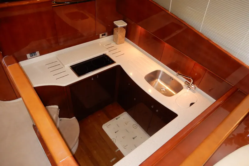 Slide: The Image of Luxurious kitchen area in a 2008 Viking Sport Cruisers 61 Motor Yacht. - 68