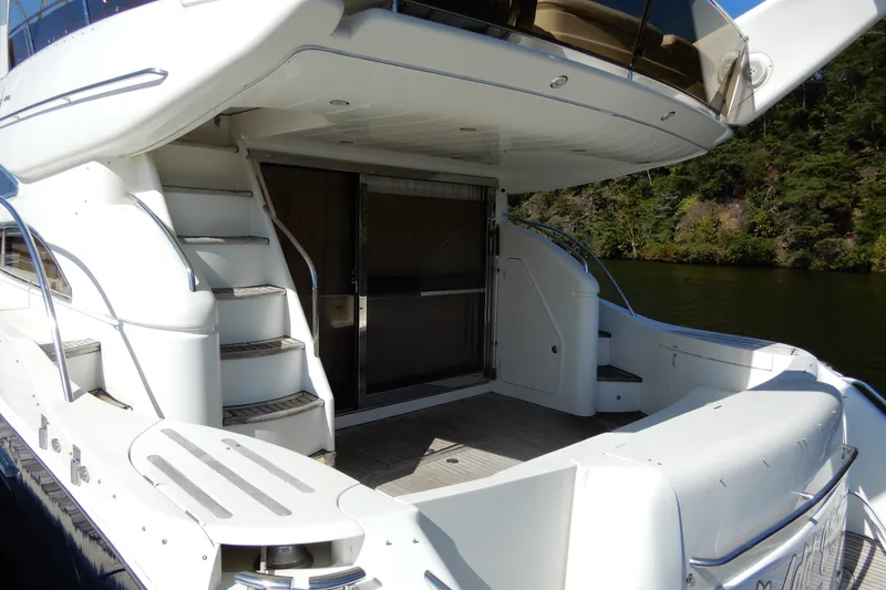 Slide: The Image of 2008 Viking Sport Cruisers 61 Motor Yacht, rear deck view with stairs and sliding door. - 8