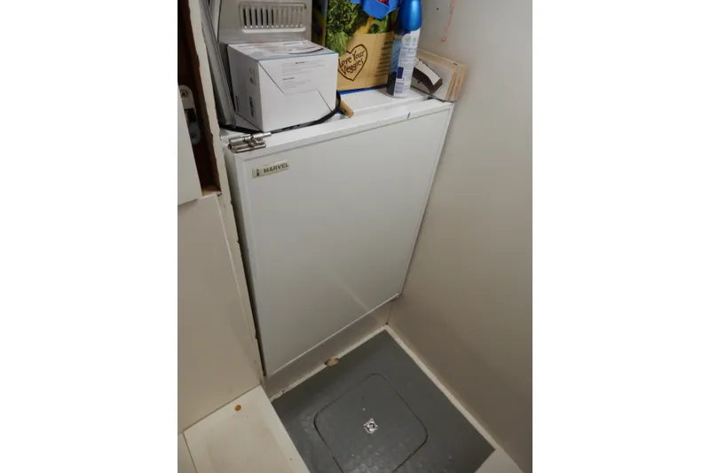 Slide: The Image of Small refrigerator in 2008 Viking Sport Cruisers 61 Motor Yacht interior. - 77