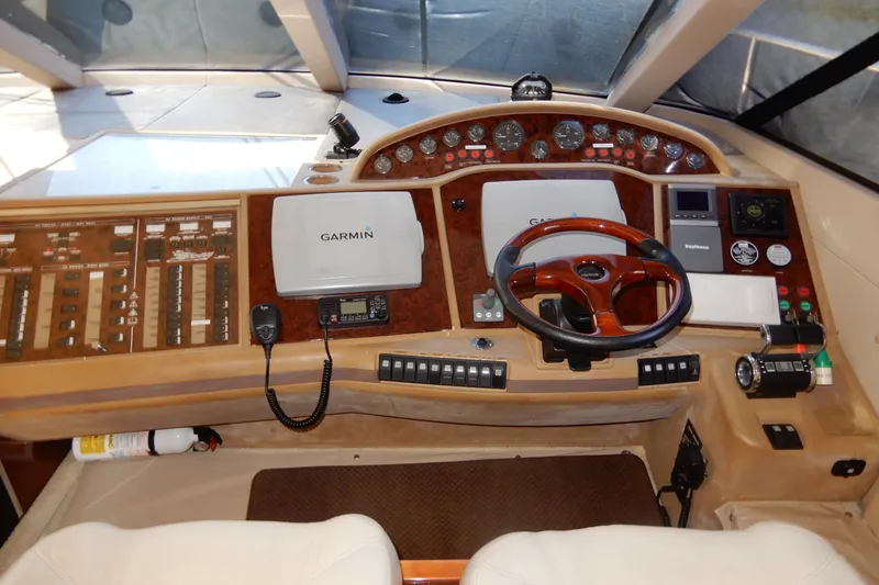 Slide: The Image of Cockpit of 2008 Viking Sport Cruisers 61 Motor Yacht with Garmin navigation system. - 82