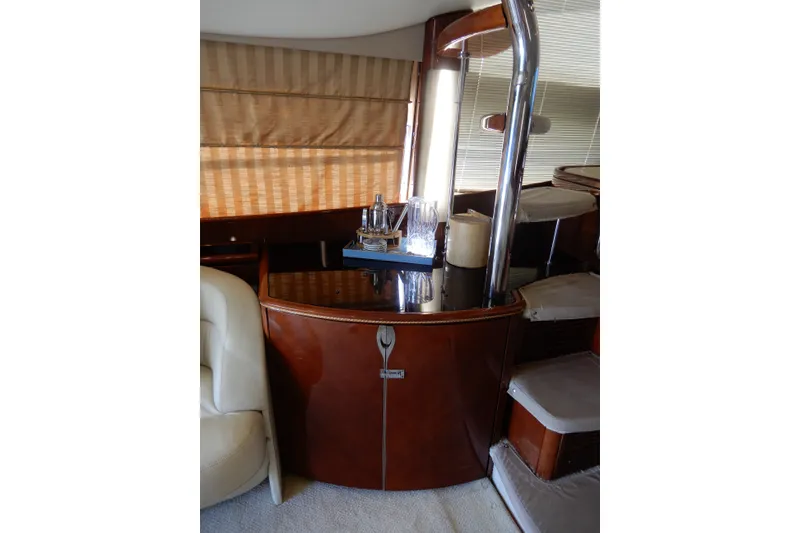 Slide: The Image of Luxurious interior of 2008 Viking Sport Cruisers 61 Motor Yacht with elegant wood finish. - 63