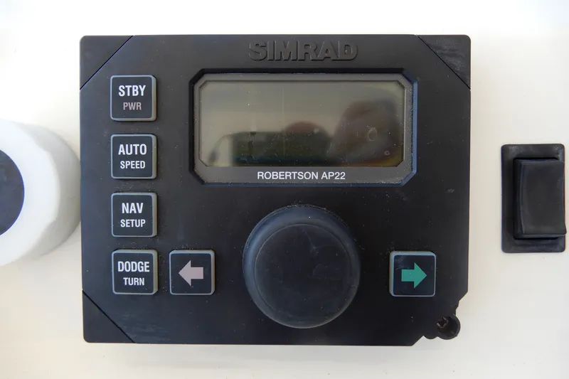 Slide: The Image of Simrad Robertson AP22 autopilot control on 2008 Viking Sport Cruisers 61 Motor Yacht. - 47