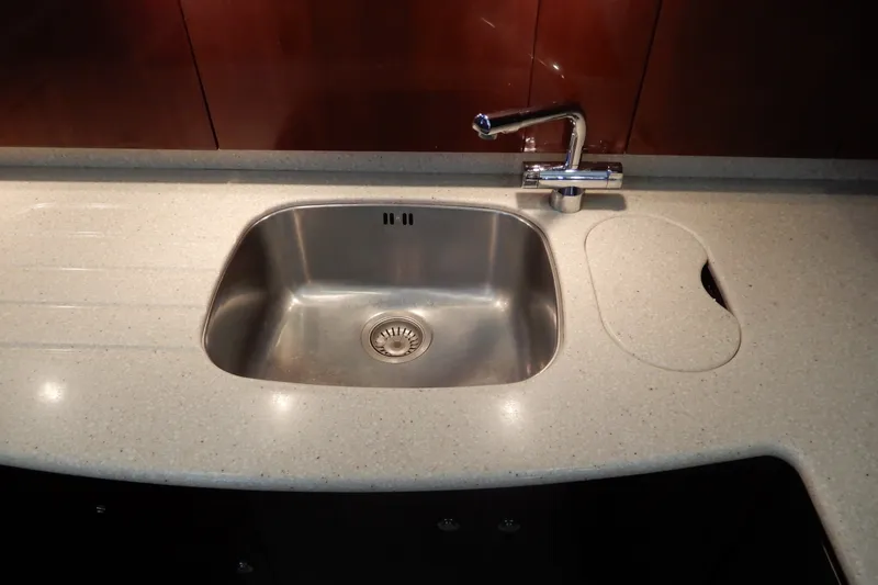 Slide: The Image of Stainless steel sink and faucet in 2008 Viking Sport Cruisers 61 Motor Yacht kitchen. - 73