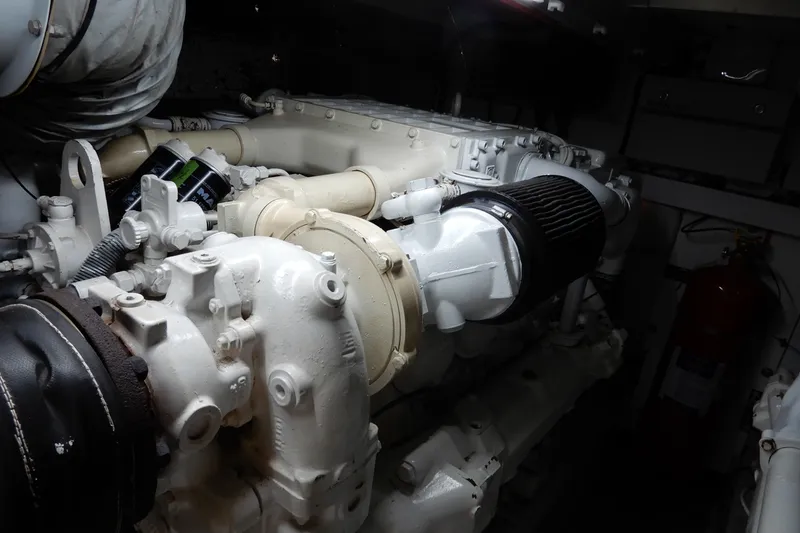 Slide: The Image of Engine room of 2008 Viking Sport Cruisers 61 Motor Yacht, showcasing mechanical components. - 128
