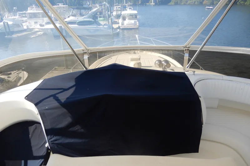Slide: The Image of 2008 Viking Sport Cruisers 61 Motor Yacht helm view at marina. - 39