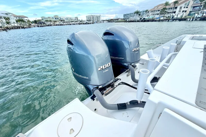 Slide: The Image of 2017 Sea Hunt Gamefish 27 with twin Yamaha 200 engines on calm water. - 9