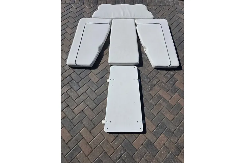Slide: The Image of White cushions and panel for 2017 Sea Hunt Gamefish 27 on brick pavement. - 28