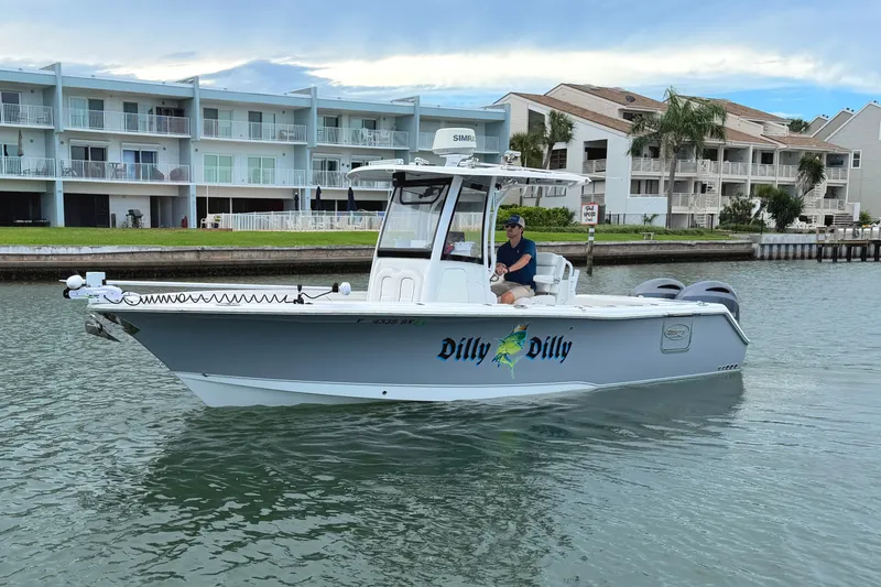 Slide: The Image of 2017 Sea Hunt Gamefish 27 boat on water near waterfront homes. - 6