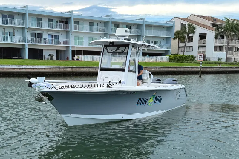 Slide: The Image of 2017 Sea Hunt Gamefish 27 boat on water near waterfront buildings. - 5
