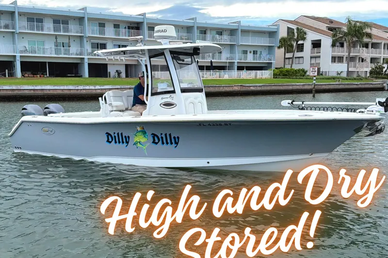 Slide: The Image of 2017 Sea Hunt Gamefish 27 boat on water, labeled "Dilly Dilly," with "High and Dry Stored!" text. - 1