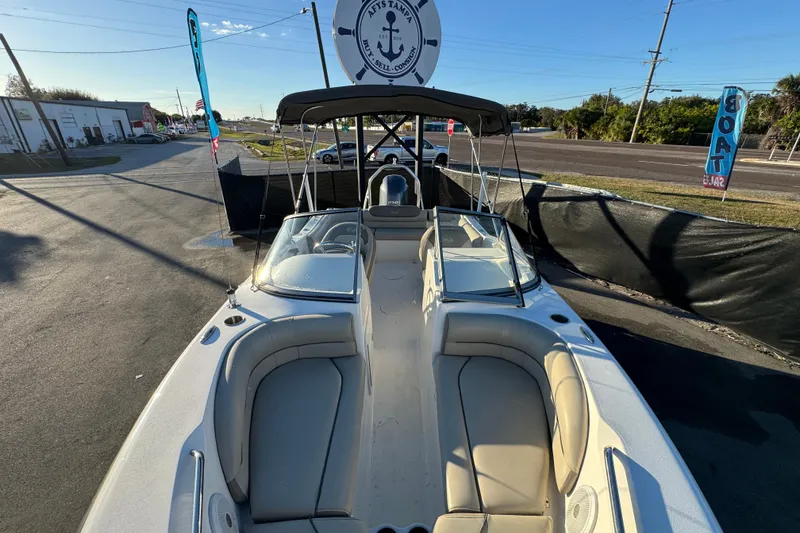 Slide: The Image of 2021 Key West 203 DFS boat with seating, displayed outdoors under sunny skies. - 41