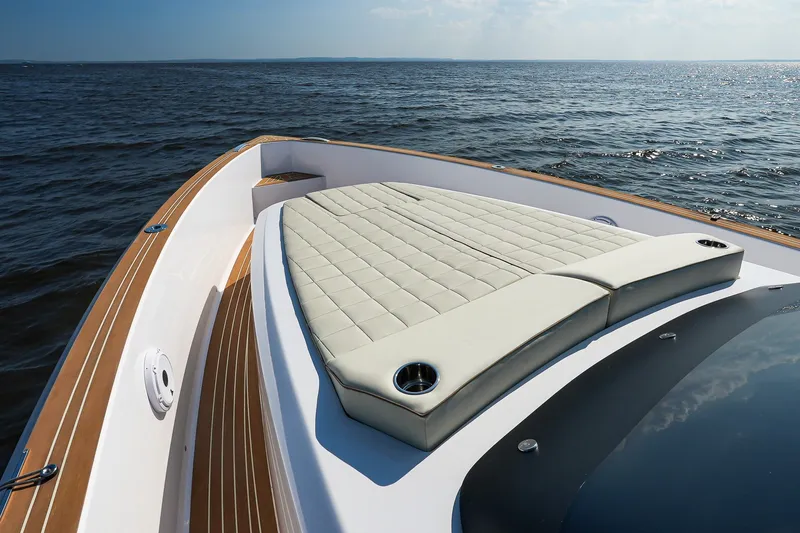 Slide: The Image of Luxury deck of 2025 Pardo Yachts P38, featuring elegant sunbed and ocean view. - 25