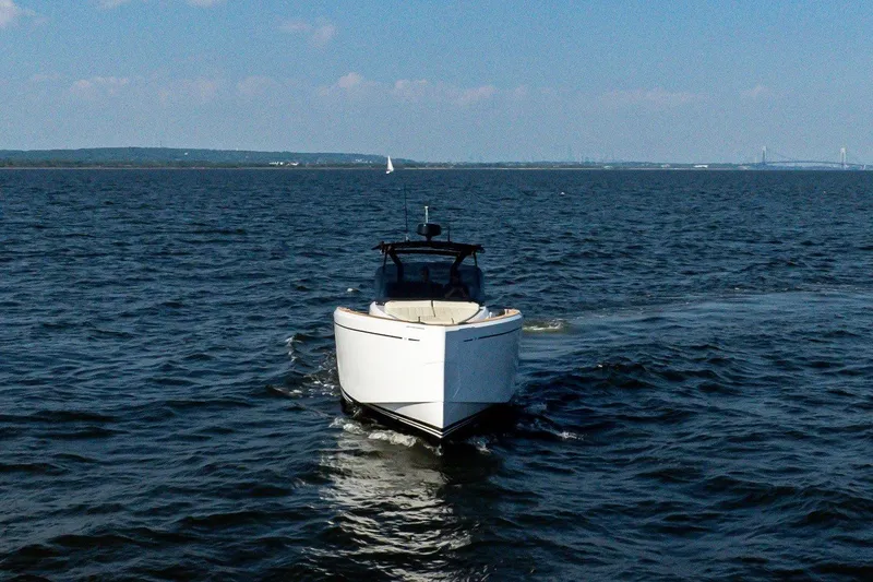 Slide: The Image of The 2025 Pardo Yachts P38 cruising on open water with a clear sky in the background. - 4