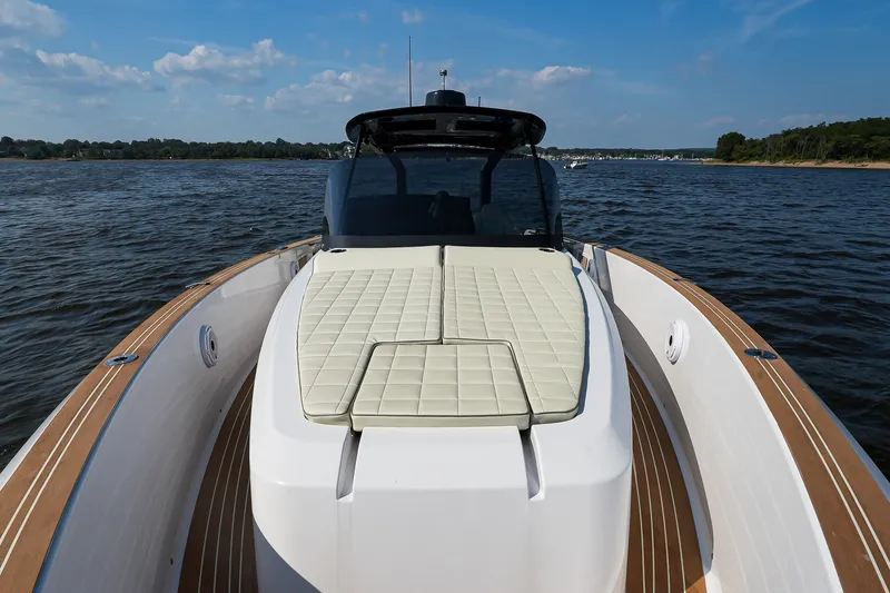 Slide: The Image of 2025 Pardo Yachts P38 on water, featuring sleek design and cushioned deck. - 24