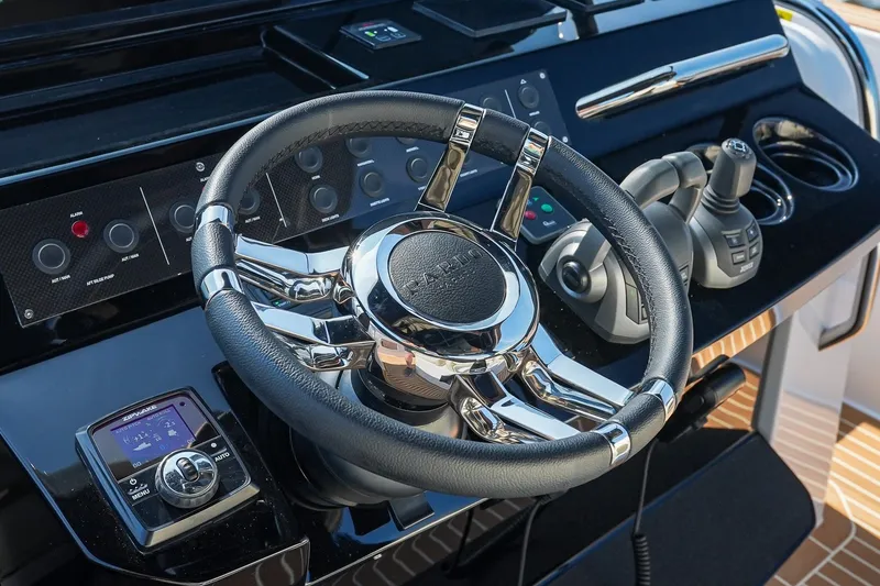 Slide: The Image of Steering wheel and controls of 2025 Pardo Yachts P38, featuring sleek design and advanced technology. - 23