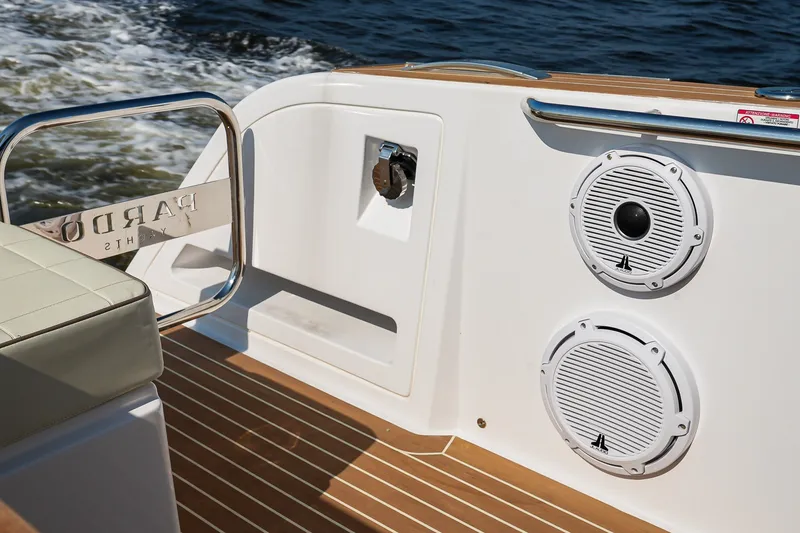 Slide: The Image of 2025 Pardo Yachts P38 interior with speakers and teak flooring, cruising on water. - 9
