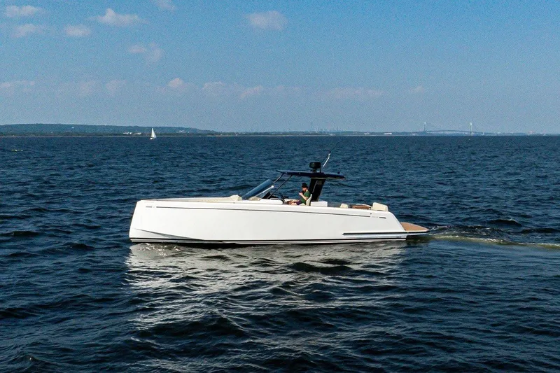 Slide: The Image of A sleek, modern motorboat by Pardo Yachts, model P38, cruising on calm waters. - 2