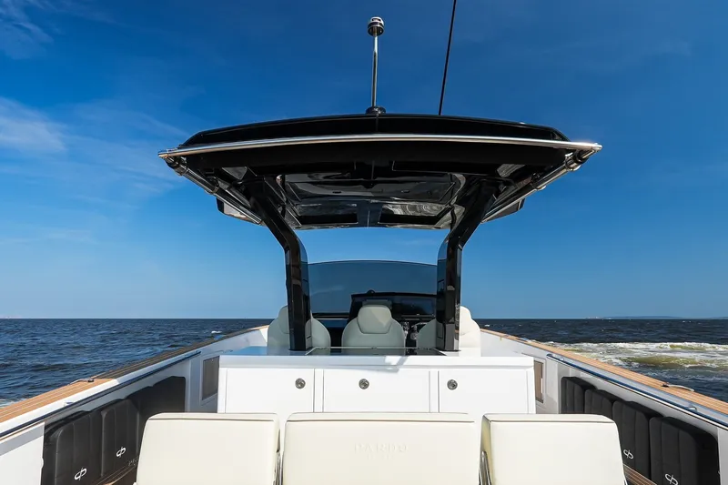 Slide: The Image of 2025 Pardo Yachts P38 cruising on open water under clear blue skies. - 17