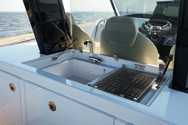 Slide: The Image of Outdoor kitchen on 2025 Pardo Yachts P38, featuring sink and grill, with ocean view. - 19
