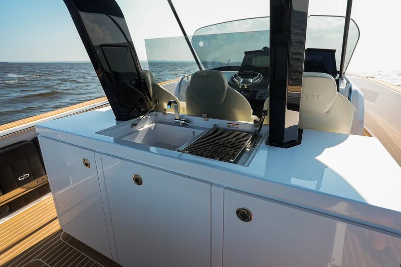 Slide: The Image of Luxury Pardo Yachts P38 2025 with sleek outdoor kitchen and ocean view. - 18