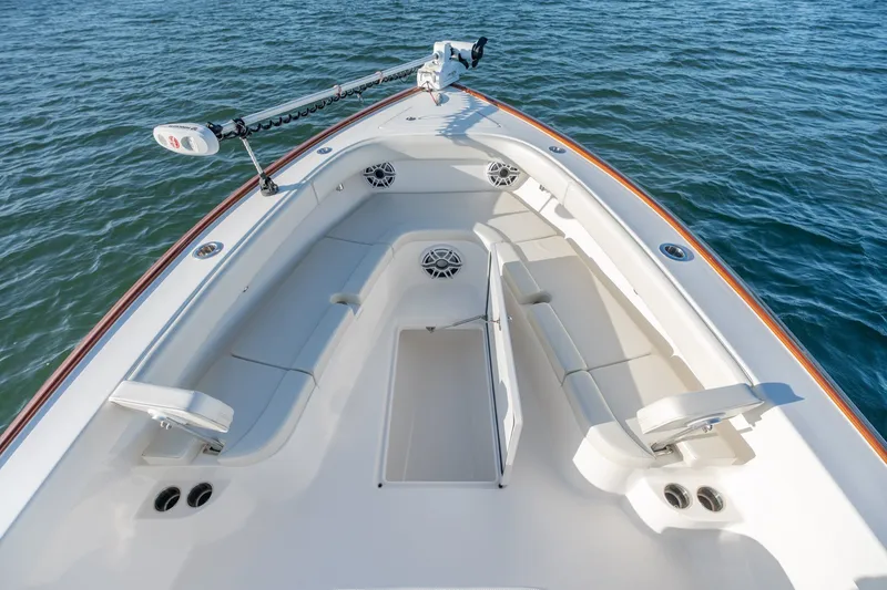 Slide: The Image of 2023 Stuart 27 Center Console boat with spacious seating on calm water. - 27