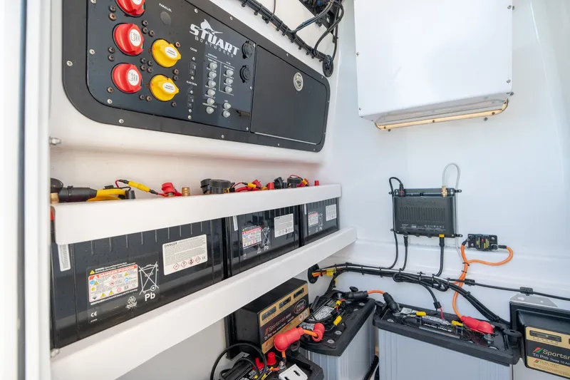 Slide: The Image of Electrical system of 2023 Stuart 27 Center Console boat with batteries and wiring. - 16