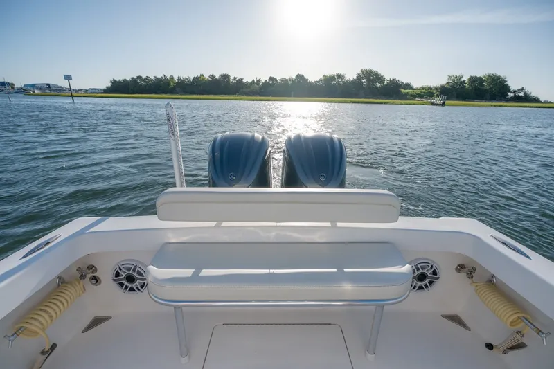 Slide: The Image of 2023 Stuart 27 Center Console boat on water, rear view with dual engines. - 20