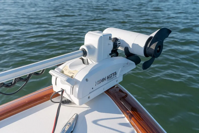 Slide: The Image of Minn Kota trolling motor on 2023 Stuart 27 Center Console boat in water. - 31