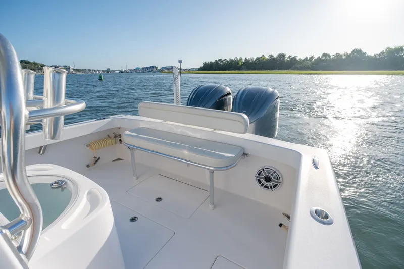 Slide: The Image of 2023 Stuart 27 Center Console boat on water, sunny day, rear seating view. - 21
