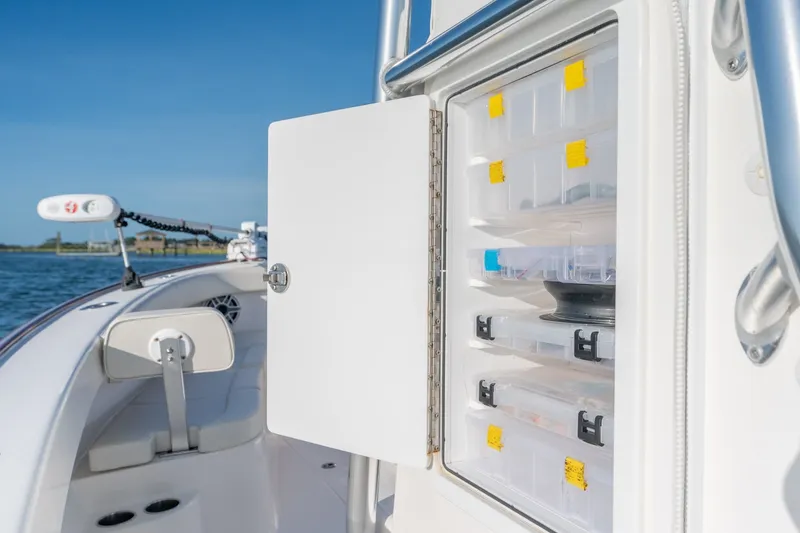 Slide: The Image of 2023 Stuart 27 Center Console boat with open storage compartment on deck. - 35
